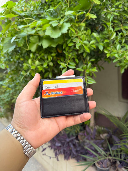 Black Slim Card Holder outdoor front view with multiple cards loaded showing UBL and Allied Bank cards