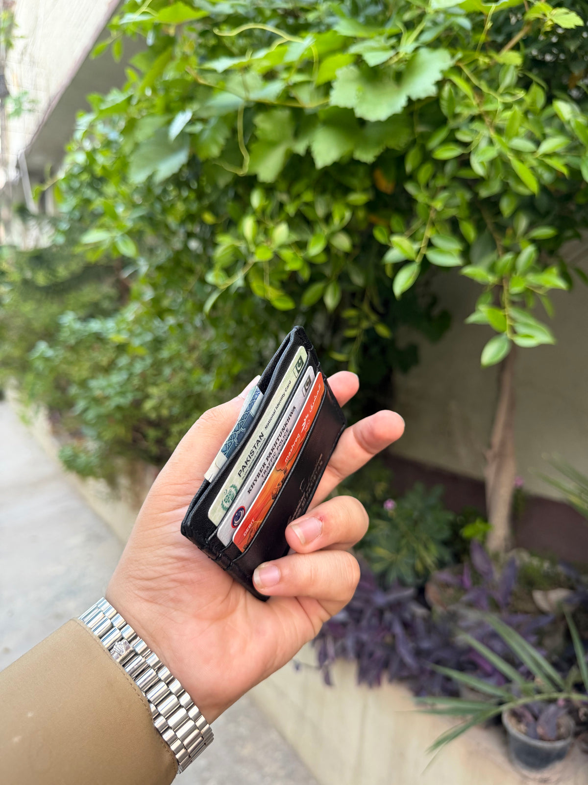 Black Slim Card Holder side view showing dual card slots fully loaded with 6 cards