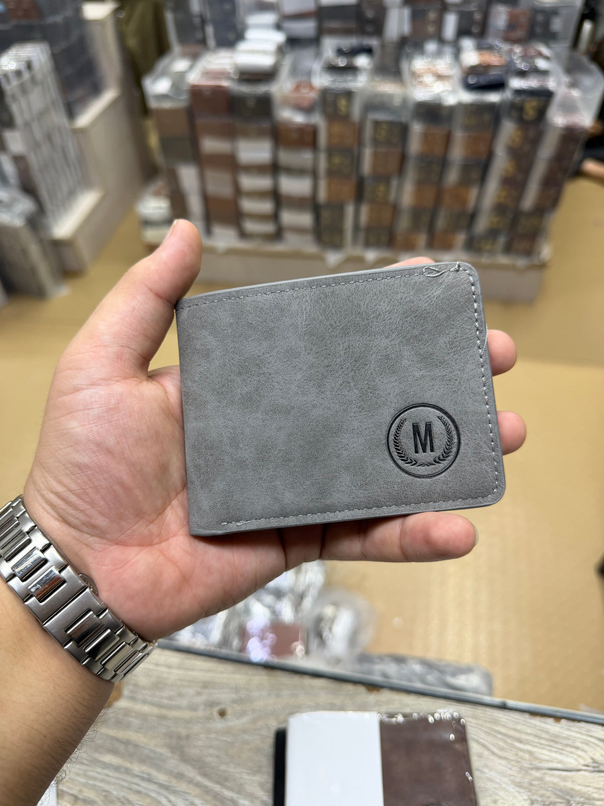 GU-II Vintage Nubuck Bifold Wallet – Black front view with embossed M logo