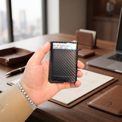 Black Carbon Fibre Pop-Up Card Holder Wallet executive lifestyle shot at office desk