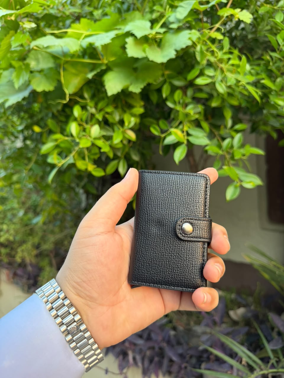 Black Pop-Up Card Wallet closed front view with bronze snap button