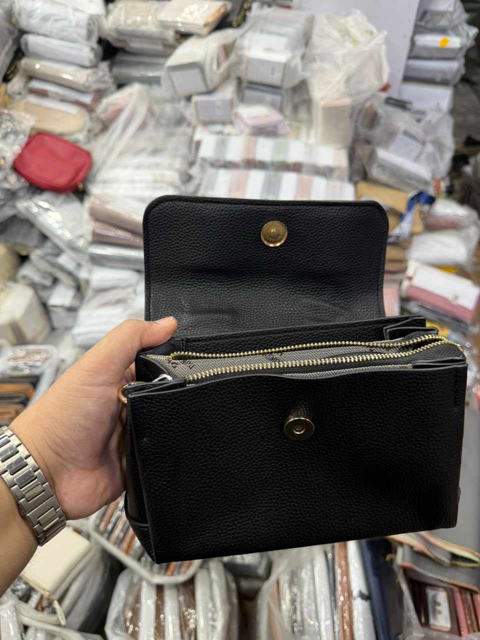 Black Dual-Zip Crossbody Bag with detachable braided rope strap and gold chain strap